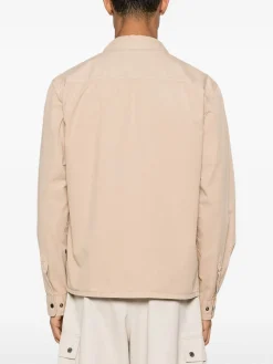 Giacca beige con tasche e chiusura a zip