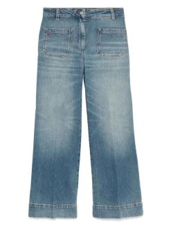 Jeans allungati con patch logo