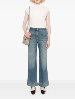 Jeans allungati con patch logo