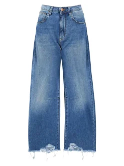 Jeans in denim blu con orlo sfilacciato