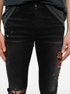 Jeans magri con patch