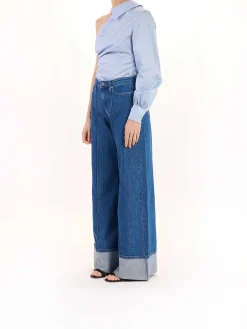 Pantaloni in denim a gamba larga piegati
