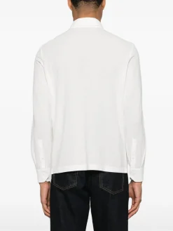 Polo in maglia bianco a maniche lunghe