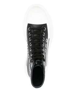Sneakers in pelle con occhielli